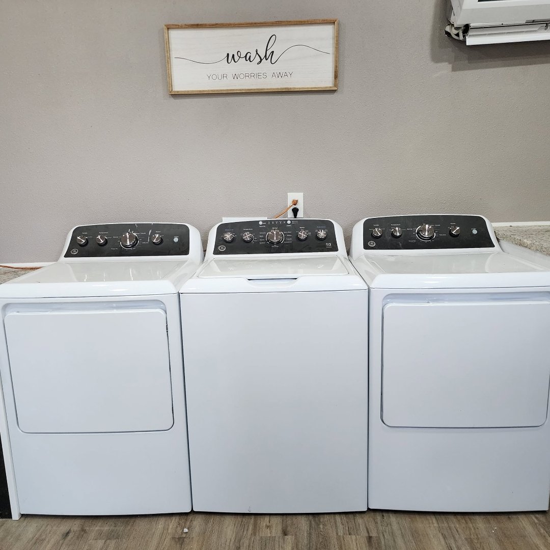Interior of the complimentary laundry room with washers and dryers